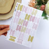Hoja de die cuts con forma de tabuladores Mi día a día. Para scrapbooking. Diseño de Alúa Cid