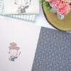 Papel laminado Enero, de Rita Vuelve a casa, diseñado por Alúa Cid para scrapbooking y manualidades