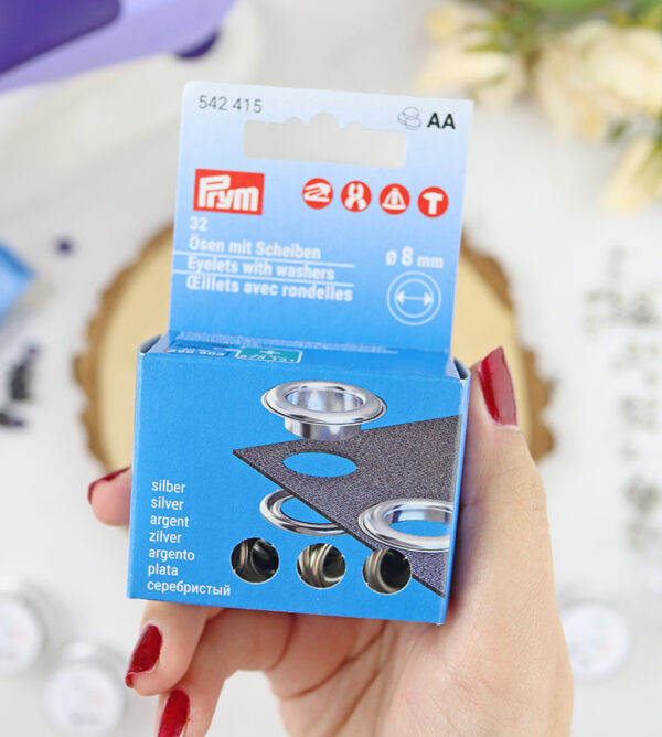 Set de 32 Ojales con Arandelas 8 mm de Prym